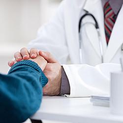 Doc Holding Patient's Hand